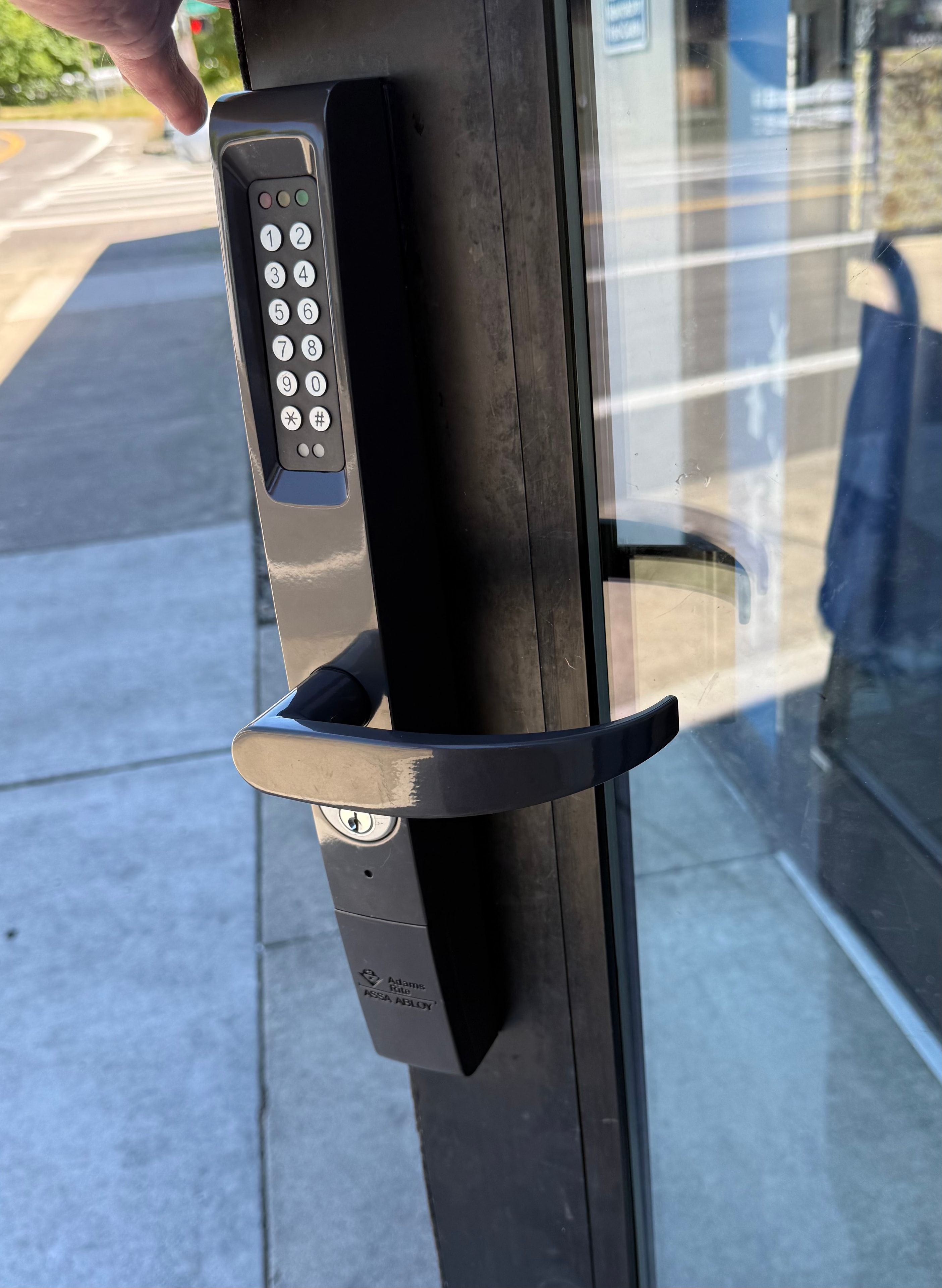 Adams Rite keypad lever and cylinder on commercial glass storefront door — locksmith Felida WA