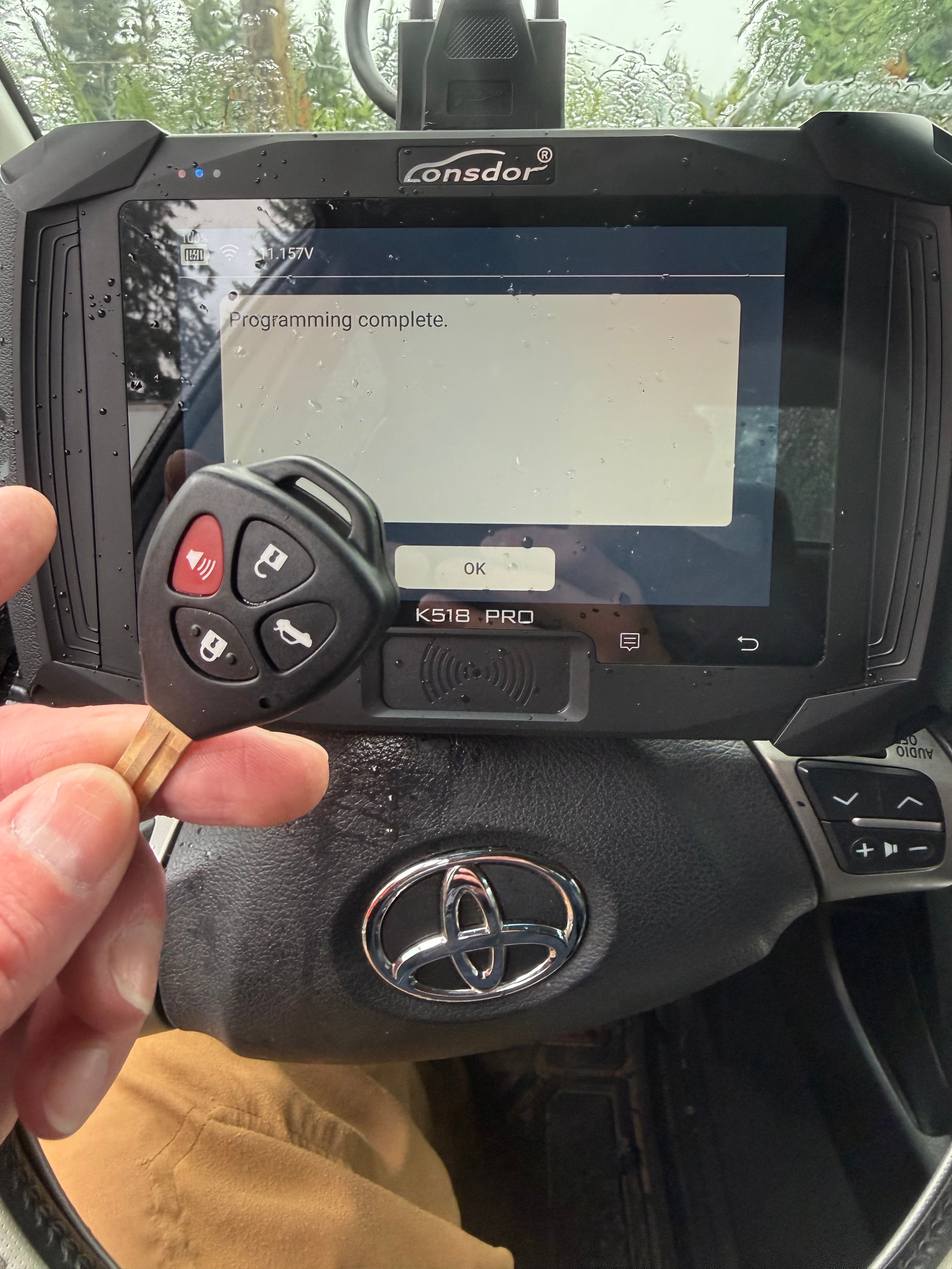 Lonsdor K518 Pro showing 'Programming complete' with Toyota remote head key — car key programming Vancouver WA